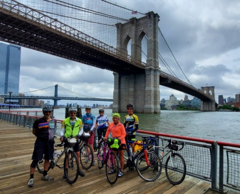 Riders next to Brooklyn Bridge